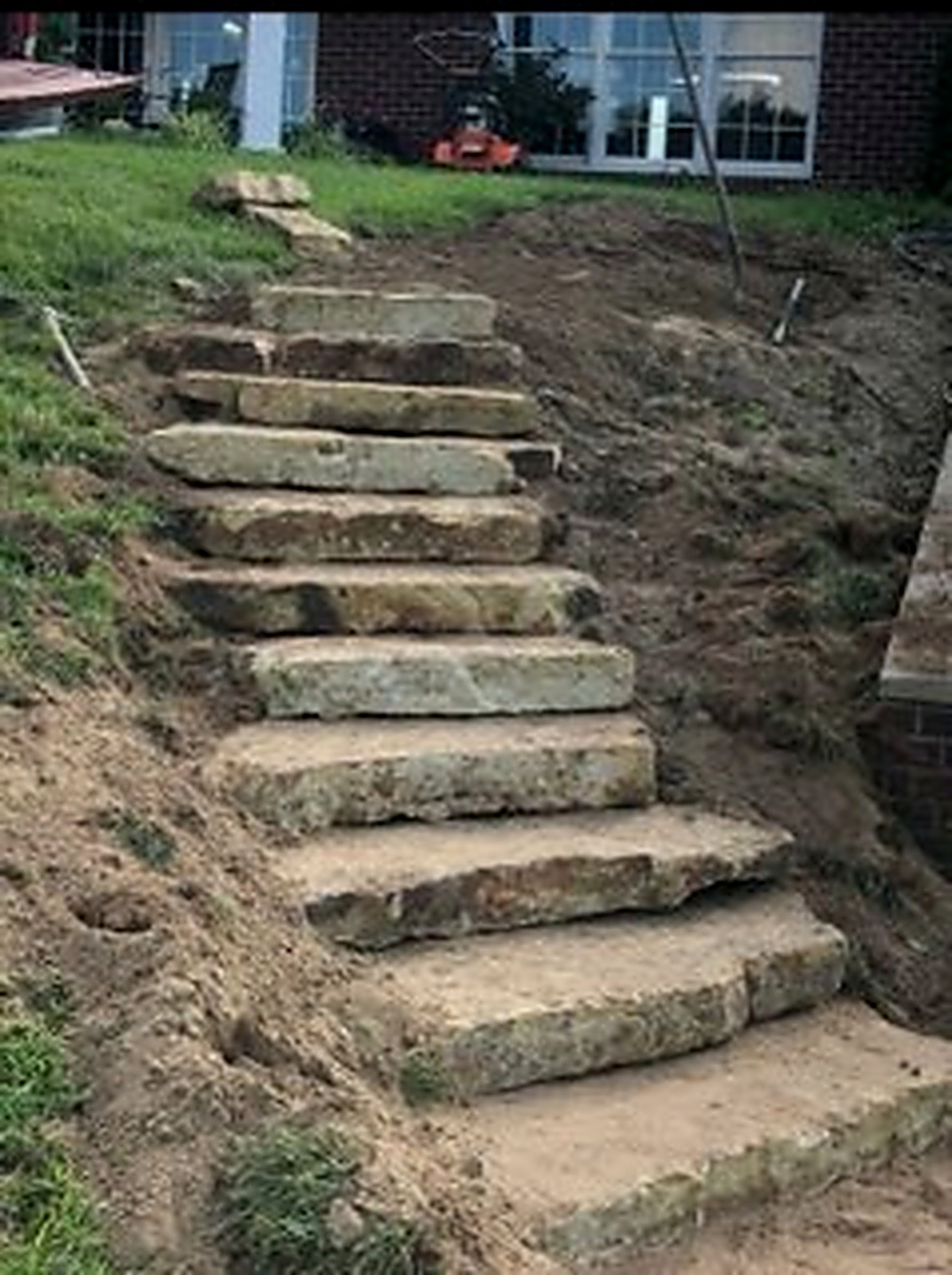 Natural stone step installation in progress